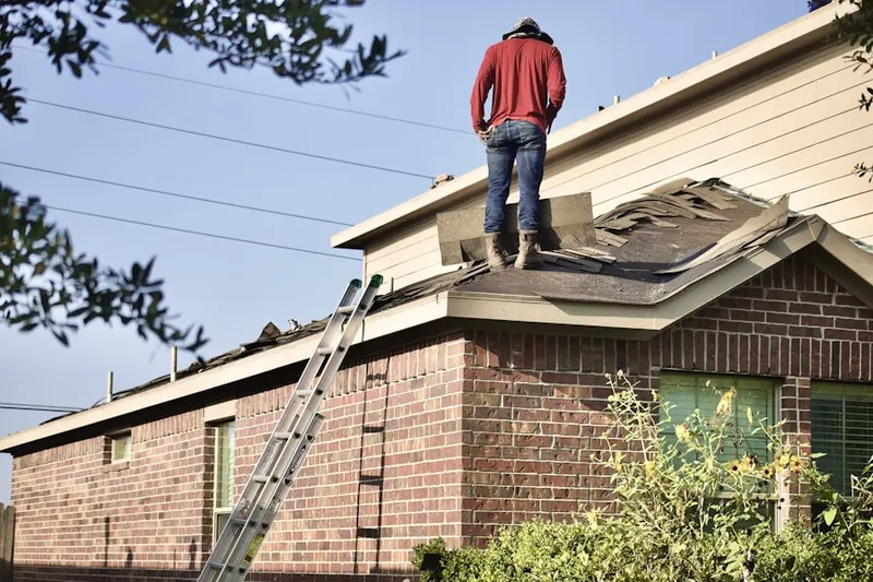 Professional roofer working on a residential roof in Walnut Crossing